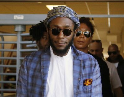 In this March 24, 2016 photo, American actor and musician Yasiin Bey, also known as Mos Def, leaves the Bellville Magistrates' Court in Bellville, South Africa. (Schalk van Zuydam / Associated Press)