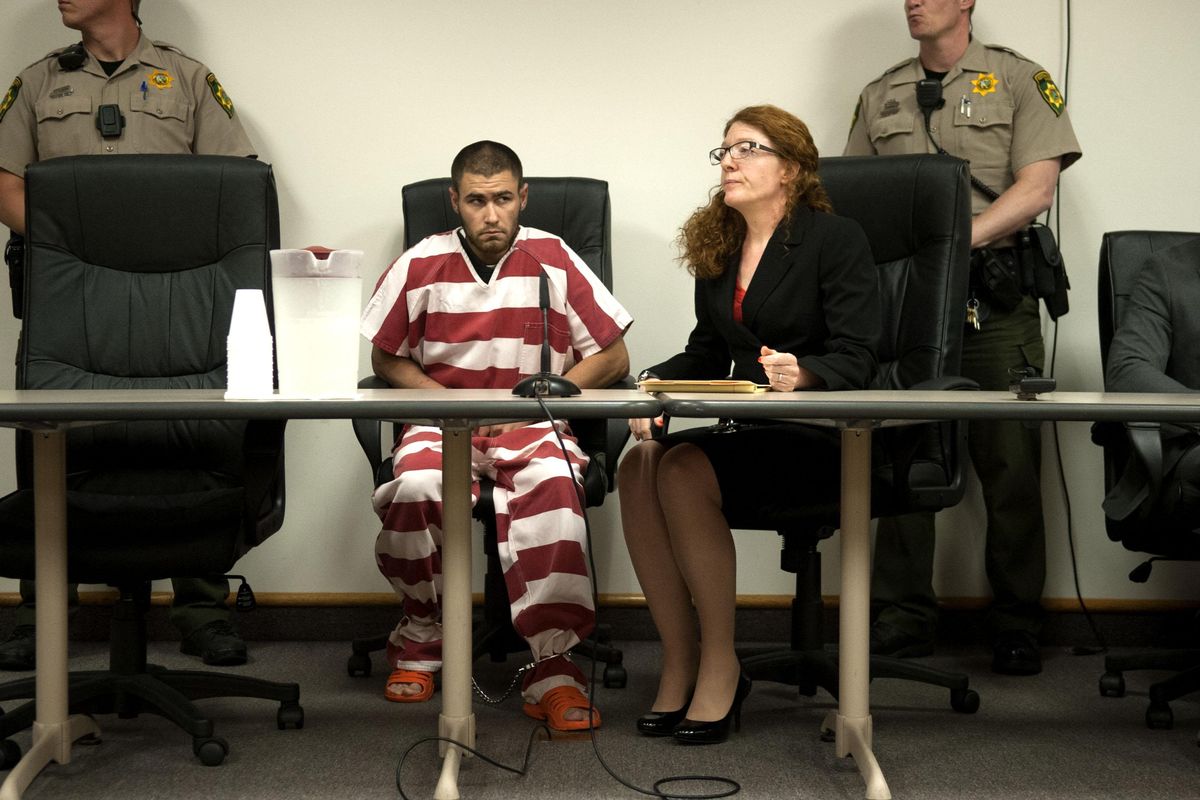 Court appointed public defender Maily Walsh sits next to Jonathan Renfro, 29, who is charged with first-degree murder in connection with the shooting death of Coeur d’Alene Police Sgt. Greg Moore on May 5, 2015. The trial, in which the state is seeking the death penalty, starts today. (Kathy Plonka / The Spokesman-Review)