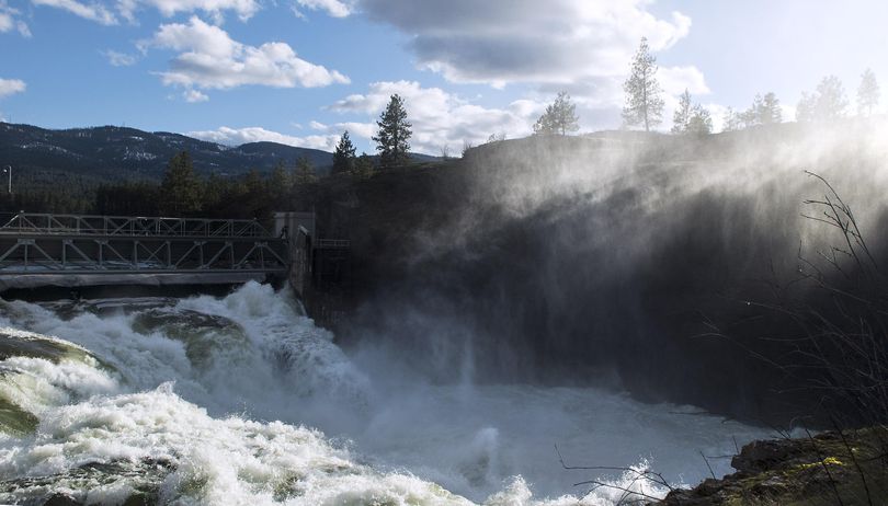Water from the Spokane River makes it's way through the Post Falls dam floodgates while the spring thaw continues on Thursday, March 16, 2017. (Kathy Plonka / The Spokesman-Review)