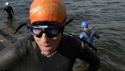 
By the time Ironman participant Michelle Schwartz, of San Diego, finished her swim Wednesday in Lake Coeur d'Alene, she was so cold she could barely talk. 
 (Kathy Plonka / The Spokesman-Review)