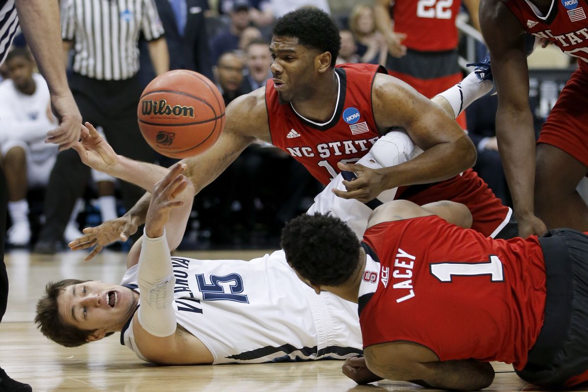 North Carolina State’s Lennard Freeman, top, and Trevor Lacey put defensive pressure on Villanova’s Cody Martin. (Associated Press)