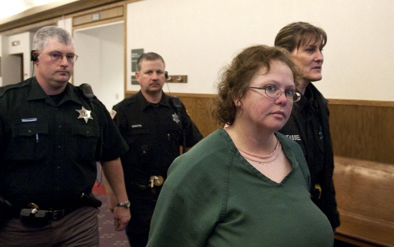 Shellye L. Stark is led into Spokane County Superior Court Judge Tari Eitzen's courtroom on Thursday, April 9, 2009. (Colin Mulvany / The Spokesman-Review)