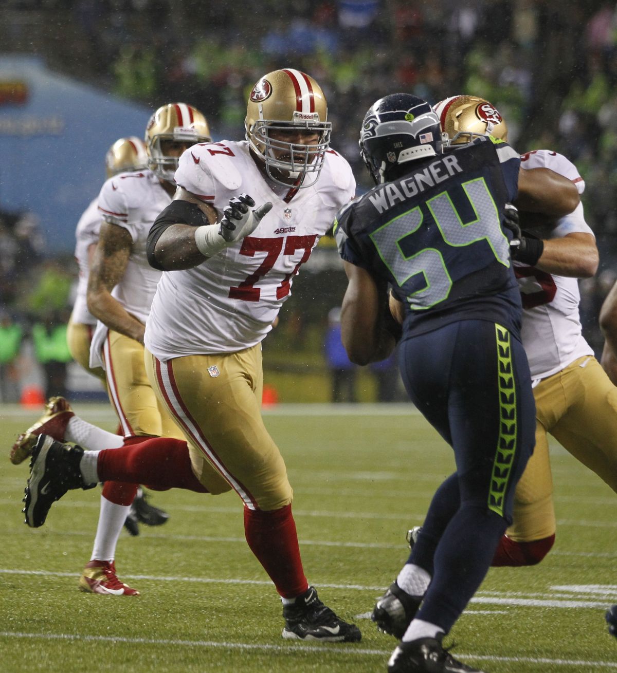 San Francisco’s Mike Iupati, left, looks to block Seattle’s Bobby Wagner in a December game won by the Seahawks in Seattle. (Associated Press)