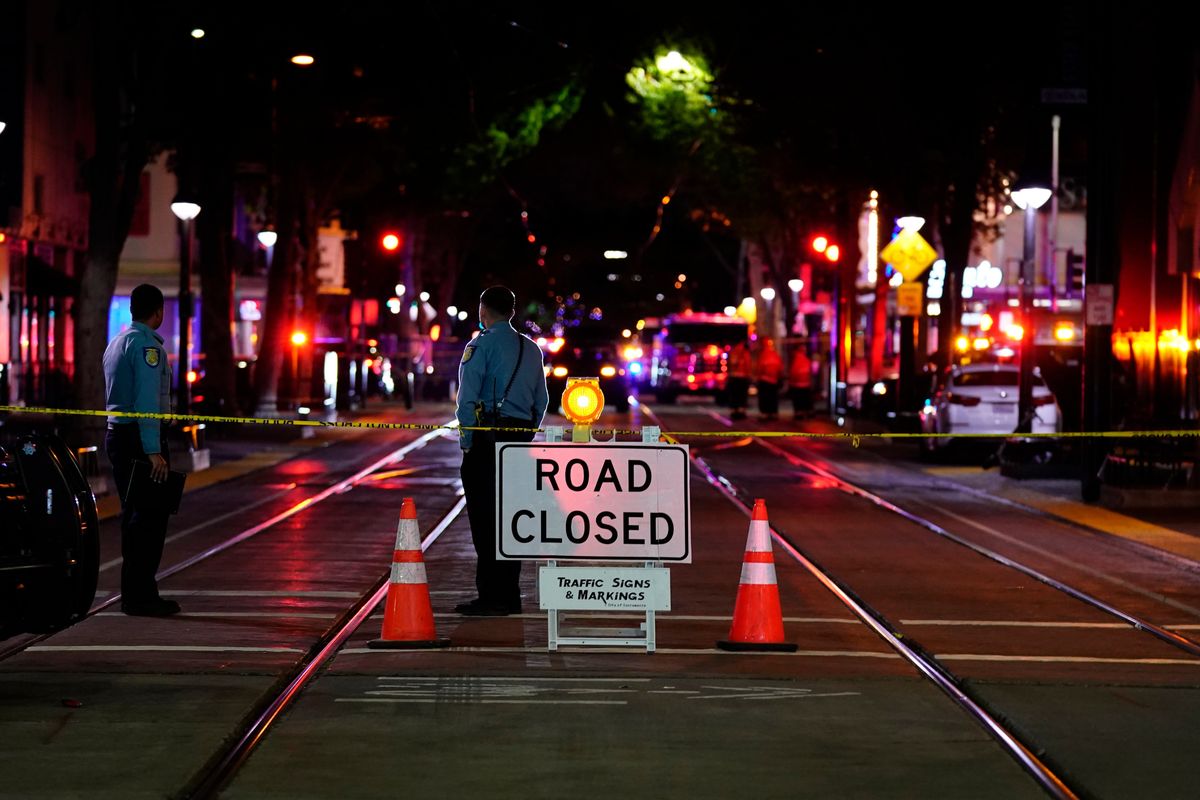 A roadblock is set a block away from the scene of an apparent mass shooting in Sacramento, Calif., Sunday, April 3, 2022.  (Rich Pedroncelli)