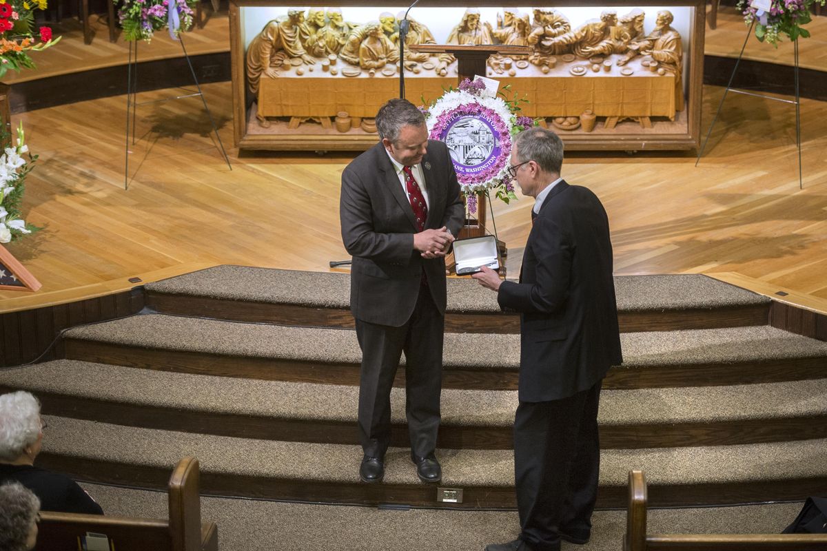 Spokane Mayor David Condon, left, presents the Key to the City to John Rodgers, son of former Mayor David H. Rodgers during a memorial service for David Rodgers, May 6, 2017, at First Presbyterian Church in Spokane, Wash. Rodgers died on April 18. (Dan Pelle / The Spokesman-Review)