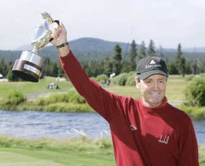 
Mark McNulty holds up his trophy after winning The Tradition in Sunriver, Ore. Associated Press
 (Associated Press / The Spokesman-Review)