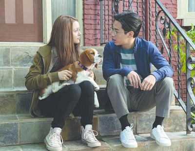 Kathryn Prescott and Henry Lau in “A Dog’s Journey.” (Universal Pictures)