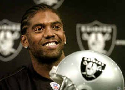 Oakland Raiders new wide receiver Randy Moss smiles during a news conference Wednesday at the Raiders' headquarters.
 (Associated Press / The Spokesman-Review)