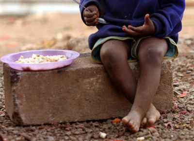 
An AIDS orphan eats from a plate of food at a kindergarten in Manzini, Swaziland, in this Aug. 26 photo. According to a United Nations report released Wednesday, without drastic measures the world will fail to meet its targets for reducing poverty over the next 10 years. 
 (Associated Press / The Spokesman-Review)