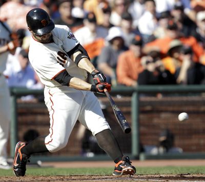Cody Ross staked the Giants to a 1-0 lead Tuesday with this run-scoring single in the fourth inning. (Associated Press / Associated Press)