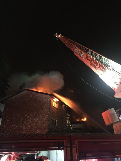 Firefighters combating flames and searching for occupants of a condominium complex in downtown Bellevue. (Bellevue Fire Department)