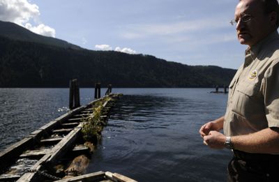 Farragut Park manager Randall Butt stands near cedar log breakwaters at the park. The breakwaters, built in 1970 will be replaced as part of improvements to the park. (Kathy Plonka / The Spokesman-Review)