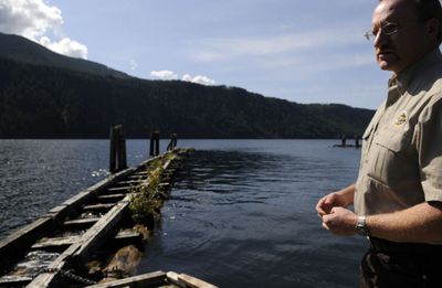 Farragut Park manager Randall Butt stands near cedar log breakwaters at the park. The breakwaters, built in 1970 will be replaced as part of improvements to the park.  (Kathy Plonka / The Spokesman-Review)