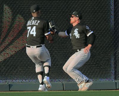Chicago White Sox center fielder Charlie Tilson, right, collides with left fielder Eloy Jimenez (74) after catching a fly ball hit by Kansas City Royals right fielder Whit Merrifield during the first inning of a baseball game at Kauffman Stadium in Kansas City, Mo., Tuesday, July 16, 2019. Jimenez was injured on the play. (Orlin Wagner / Associated Press)