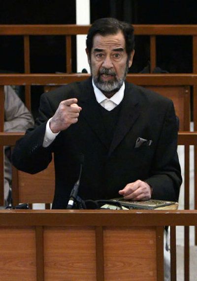 
Former Iraqi leader Saddam Hussein addresses the court last month during his trial.  
 (Associated Press / The Spokesman-Review)