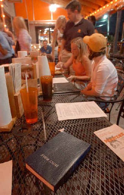 
 A  Bible sits on a table during a Bible study group which met last month at the Hooters restaurant  in Kennesaw, Ga. 
 (Associated Press / The Spokesman-Review)