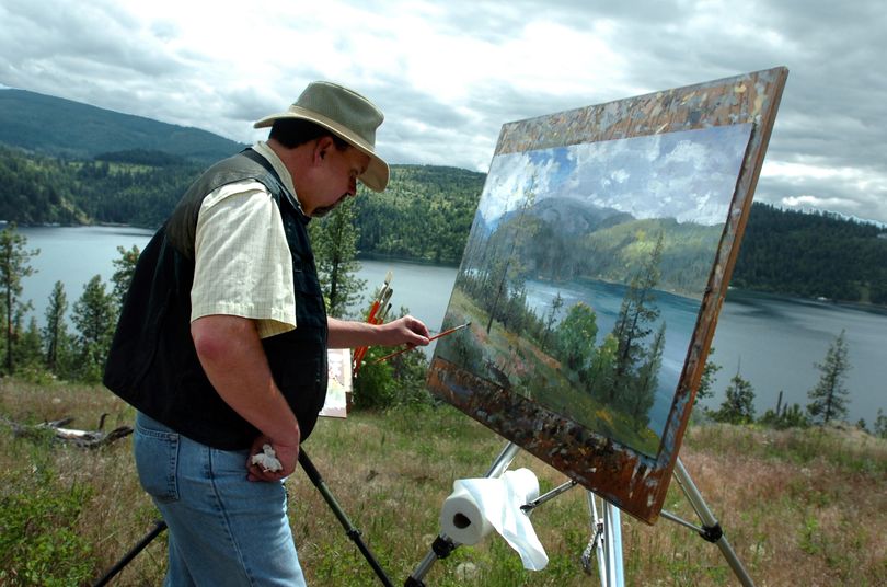 Painter Thomas Kinkade works on a landscape painting of Lake Coeur d'Alene from a hillside where builders will begin a series of luxury homes based on his paintings.  Kinkade said each house will come with a print of the painting.  At a media event Saturday, June 17, 2006, the builders and Kinkade plugged the idea and showed off the lakeview property.    Jesse Tinsley The SPOKESMAN-REVIEW (Jesse Tinsley / The Idaho Spokesman Review)