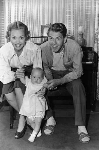 
Associated Press photos Jane Wyman and Ronald Reagan hold their 9-month-old daughter, Maureen, at their Hollywood, Calif., home in 1941.
 (Associated Press photos / The Spokesman-Review)