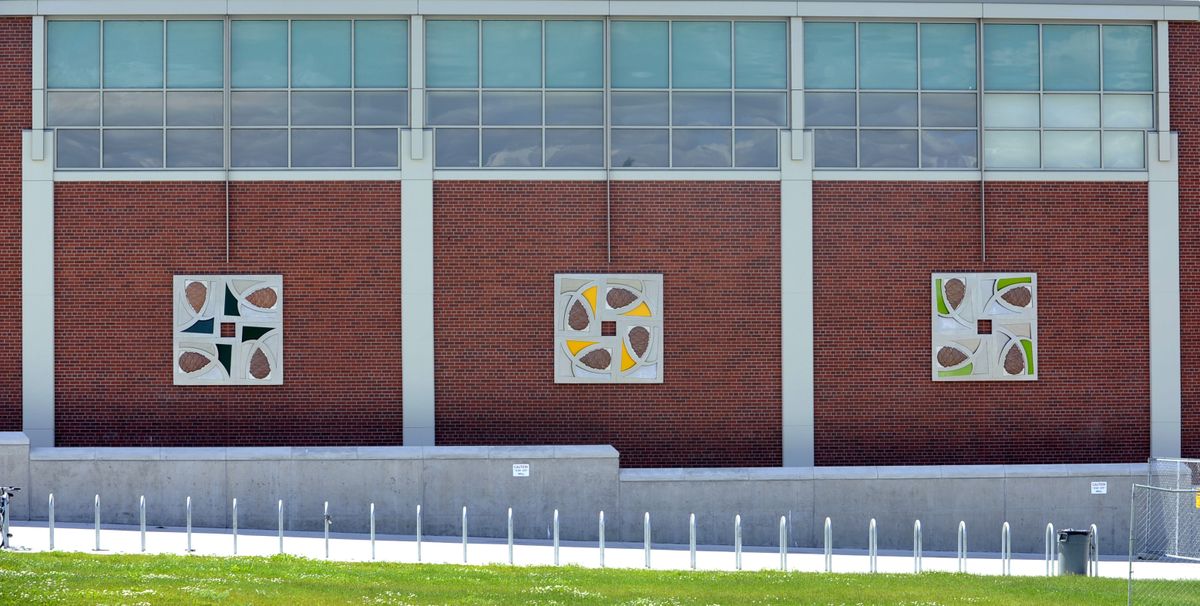 Anne Storrs’ mural art pieces hang on the north-facing wall of the new Shadle Park High School gymnasium. (Dan Pelle)