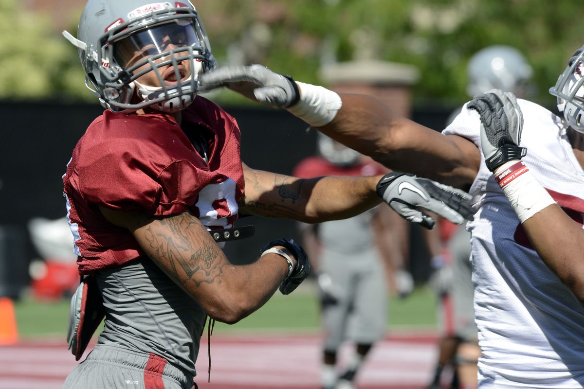 WSU freshman receiver Gabe Marks takes it on the chin from a teammate. (Dan Pelle)