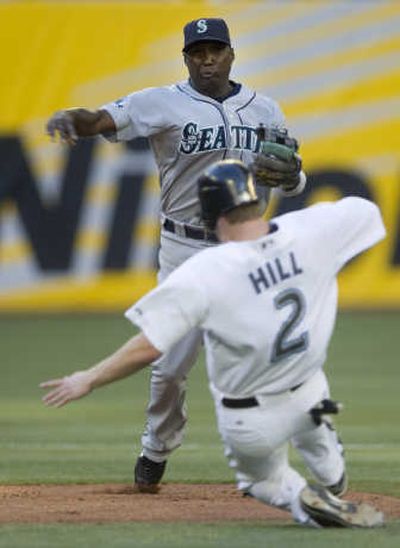 Seattle's Yuniesky Betancourt completes a double play.Associated Press
(Associated Press / The Spokesman-Review)