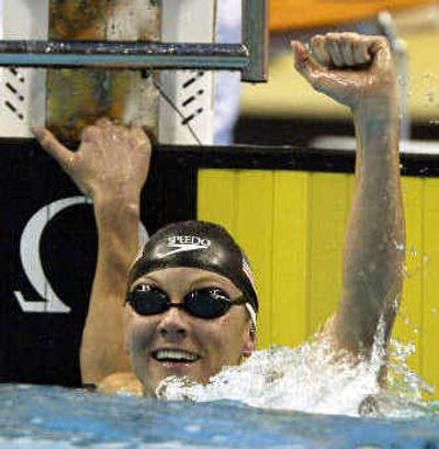 
Jenny Thompson celebrates after winning the gold medal in the finals of the 50-meter butterfly.
 (Associated Press / The Spokesman-Review)