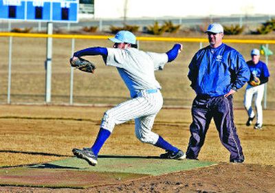 
Volunteer coach Jeff Simmelink oversees at Central Valley High School's first practice. He's careful to monitor pitch counts and watch his player's stress levels so they don't wreck a potential baseball career with a high school injury. He is also the head coach of the a Spokane Dodgers traveling baseball team.
 (J. BART RAYNIAK / The Spokesman-Review)