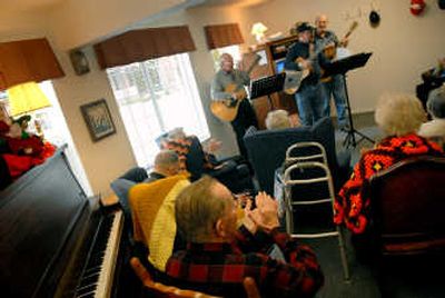 
Park Place Retirement Community residents applaud  after a song performed by the Good News Brothers.
 (The Spokesman-Review)