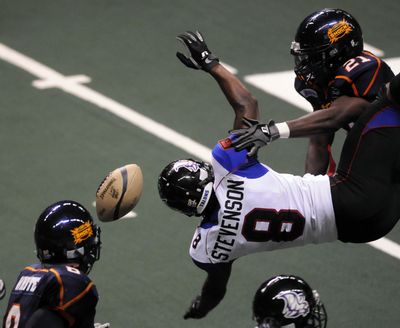Spokane Shock #12 Virgil Gray lays a hit and knock the ball away from Tulsa's #8 LaRico Stevenson during a Spokane on-sides kick int he first half in Spokane, Wa.  The Shock recoved the ball.  DAN PELLE danp@spokesman.com (Dan Pelle / The Spokesman-Review)