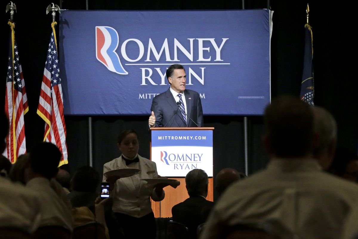 Lunch is served as Republican presidential candidate and former Massachusetts Gov. Mitt Romney speaks at a campaign fundraising event, the first of which reporters