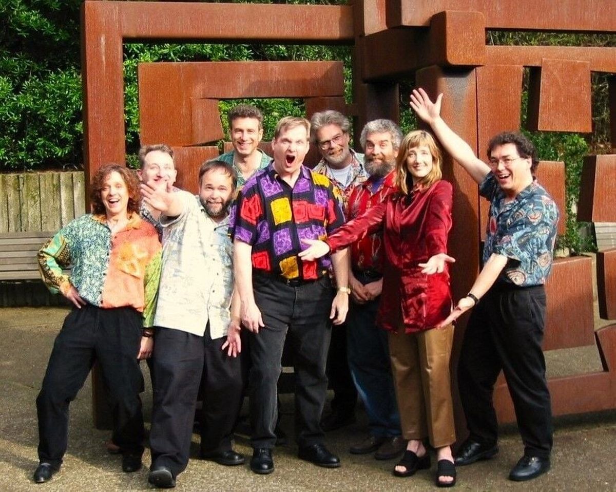 Desafinado poses in one of many group photos they took together as a nine-member Brazilian jazz group. “They of course are from 20 years ago,” says band co-leader Gary Edighoffer, “but we all look the same.” Desafinado will reunite for one night on Friday at Hamilton Studio.  (Courtesy)