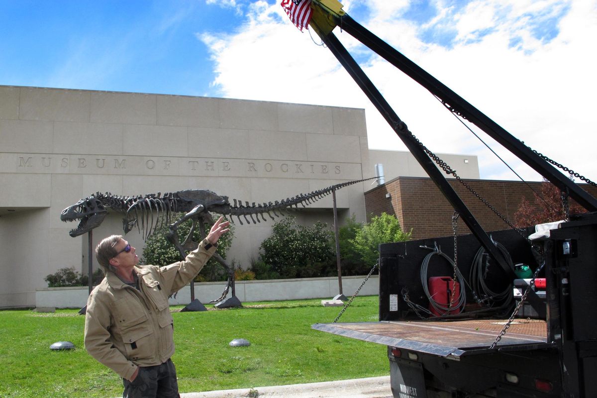 Bob Harmon describes the modifications to “Big Red,” the truck he and Jack Horner used on dinosaur excavations since the early 1990s in Bozeman. (Matt Volz / AP)