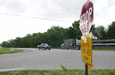 
The junction of 220th Street and West Center Street in Omaha, Neb., is seen Friday. Television cameraman Jeff Frolio, 45, was killed at the intersection Thursday. 
 (Associated Press / The Spokesman-Review)