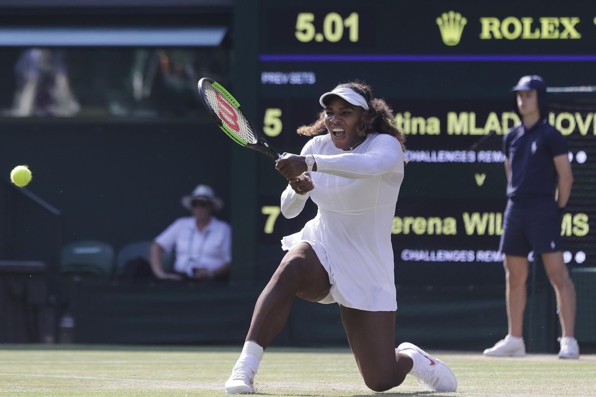 Serena Williams of the United States returns the ball to France’s Kristina Mladenovic during their women’s singles match, on the fifth day of the Wimbledon Tennis Championships in London, Friday July 6, 2018. (Ben Curtis / Associated Press)
