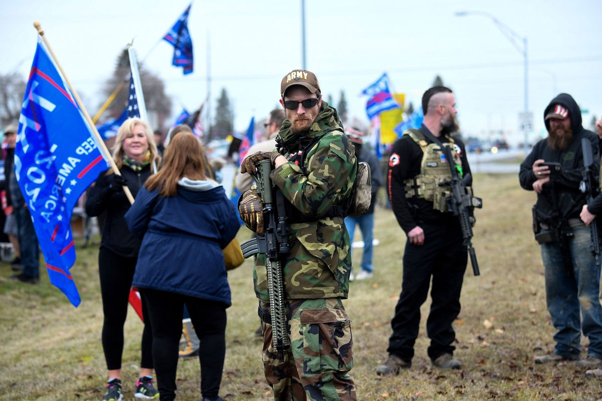 Armed citizen Richard Henry, of Coeur d’Alene, walks through the crowd of President Donald Trump supporters during an election protest organized by North Idaho Freedom Fighters on Jan. 6, 2021, in Coeur d’Alene.  (Kathy Plonka/The Spokesman-Review)