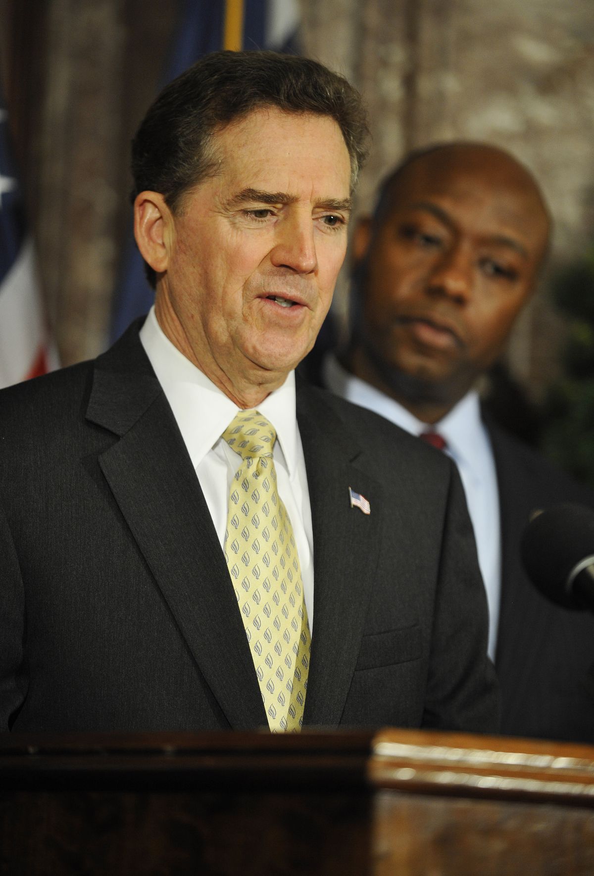 U.S. Sen. Jim DeMint, left, speaks during a news conference as U.S. Rep. Tim Scott looks on after Scott was named his replacement in the U.S. Senate at the South Carolina Statehouse on Monday, Dec. 17, 2012, in Columbia, S.C. (Rainier Ehrhardt / Fr155191 Ap)