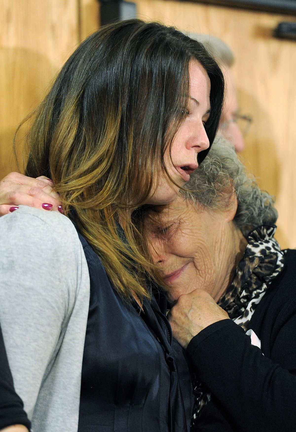 Marlene Knobbe, right, hugs her granddaughter Amanda Medek, left, at a press conference bu families of victims in the Colorado theater shooting in Aurora, Colo., on Tuesday, Aug. 28, 2012. Amanda lost her sister Micayla Medek in the shooting. Families of some of the 12 people killed in the Colorado theater shooting are upset with the way the millions of dollars raised since the tragedy are being distributed. (Chris Schneider / Fr170036 Ap)