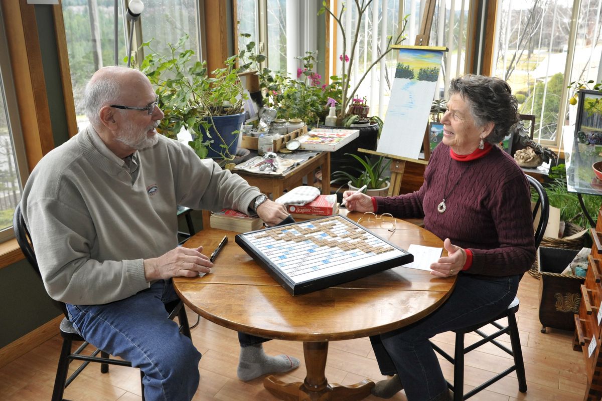 In between painting, Chuck and Alice Harmon like to play a game of Scrabble. (Colin Mulvany)