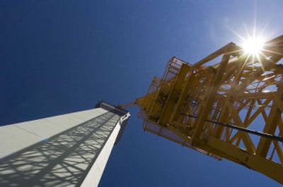 
The crane throws a shadow on the new control tower at Spokane International Airport. 
 (The Spokesman-Review)