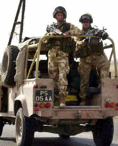 
British troops leave the center of Basra on Thursday. Britain said Thursday a battalion of British troops would be redeployed into volatile central Iraq, meeting a U.S. request despite strong opposition within the governing Labor Party. 
 (Associated Press / The Spokesman-Review)