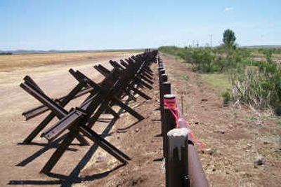
This picture taken Friday of a portion of the U.S.- Mexico border near Columbus, New Mexico shows the disputed metal pipe fence on the right that protrudes into Mexico by several feet. Associated Press
 (Associated Press / The Spokesman-Review)