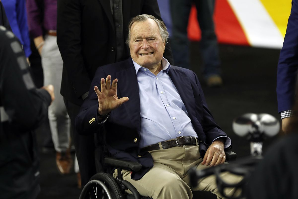 In this April 2, 2016, photo, former President George H.W. Bush waves as he arrives at NRG Stadium before the NCAA Final Four tournament college basketball semifinal game between Villanova and Oklahoma in Houston. H.W. Bush has died at age 94, according to a spokesman. (David J. Phillip / Associated Press)