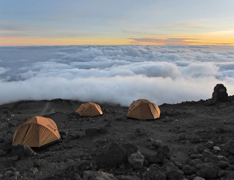 Dawn's first light illuminates Barafu, the base camp. From here, at 14,950 feet, climbers begin their final push to Kilimanjaro's summit. (Nick Follger)