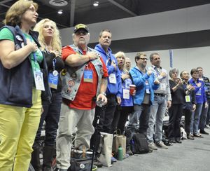TACOMA -- Delegates to the Washington Democratic Convention recite the Pledge of Allegiance at the start of their state convention Saturday. (Jim Camden/The Spokesman-Review)