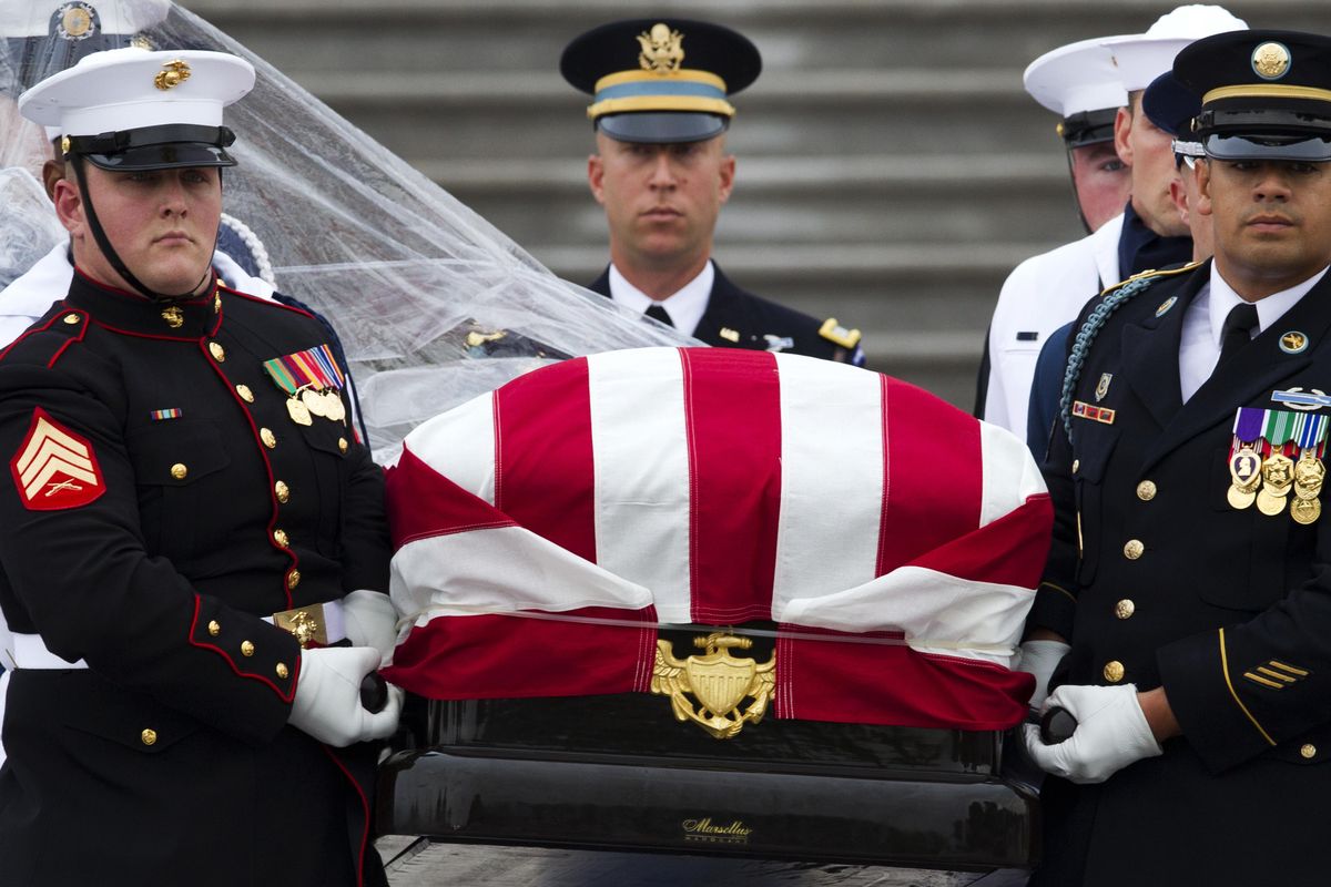 The flag-draped casket of Sen. John McCain, R-Ariz., is carried to a hearse from the U.S. Capitol in Washington, Saturday, Sept. 1, 2018, in Washington, for a departure to the Washington National Cathedral for a memorial service. McCain died Aug. 25 from brain cancer at age 81. (Jose Luis Magana / Associated Press)