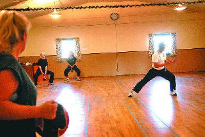 
Dave Faagau, a former pastor, teaches a fitness boot camp at Five Mile Grange. 
 (Jed Conklin / The Spokesman-Review)