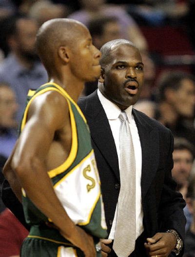 
Seattle's Ray Allen shares a moment with his former coach Nate McMillan, who now coaches Portland. 
 (Associated Press / The Spokesman-Review)