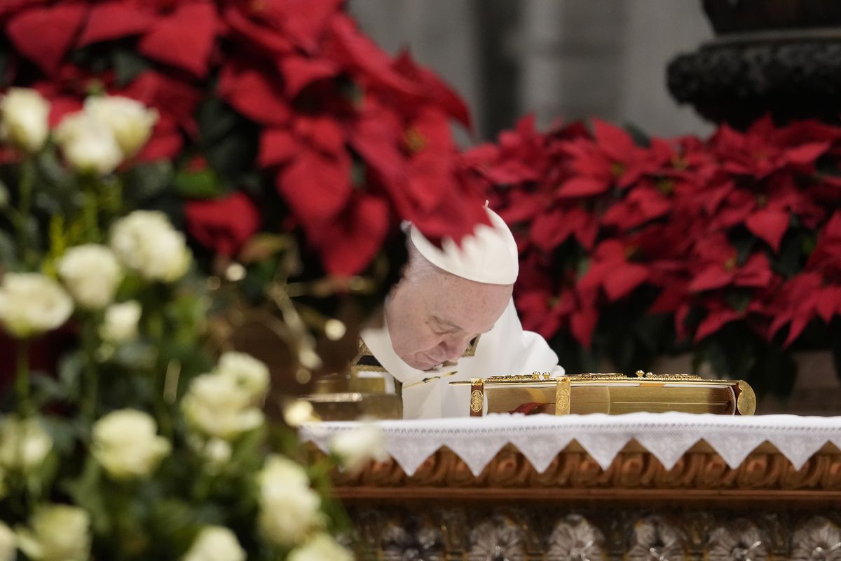 Pope Francis bows on the altar as he celebrates an Epiphany mass in St. Peter's Basilica, at the Vatican, Thursday, Jan. 6, 2022.  (Gregorio Borgia)