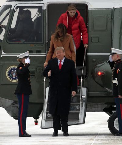 President Donald Trump walks with his wife, first lady Melania Trump, and their son, Barron Trump, on the tarmac of Andrews Air Force Base, Md., to switch from Marine One to Air Force One that took the first family for the weekend to his Mar-a-Lago estate in Palm Beach, Fla., Friday, Feb. 1, 2019. (Manuel Balce Ceneta / Associated Press)