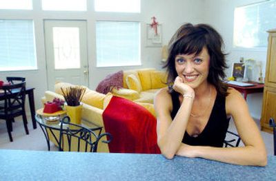 
Jennifer Bradley at home in her Coeur d'Alene apartment . High ceilings and a contemporary eclectic decor makes it feel homey. 
 (Joe Barrentine / The Spokesman-Review)